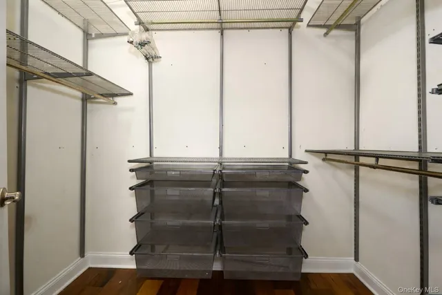 a bathroom with a granite countertop sink mirror and shower