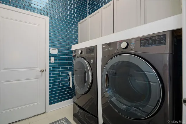 a view of a house with stairs and wooden fence