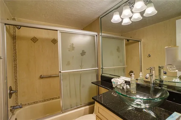 a bedroom with two beds and a desk