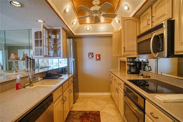 a kitchen that has a sink and a stove