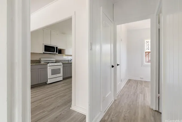 a view of a kitchen from the hallway