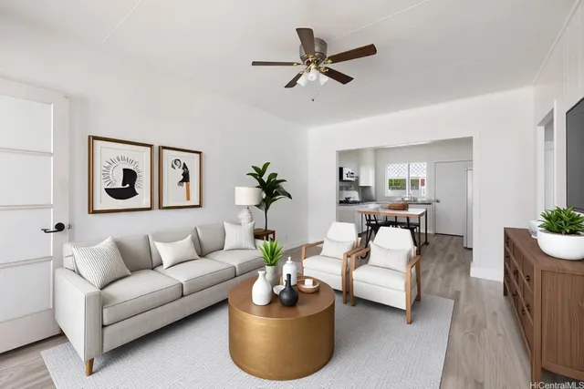 a living room with furniture and a potted plant