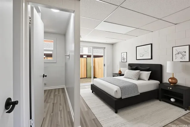 a bedroom with a bed and a mirror