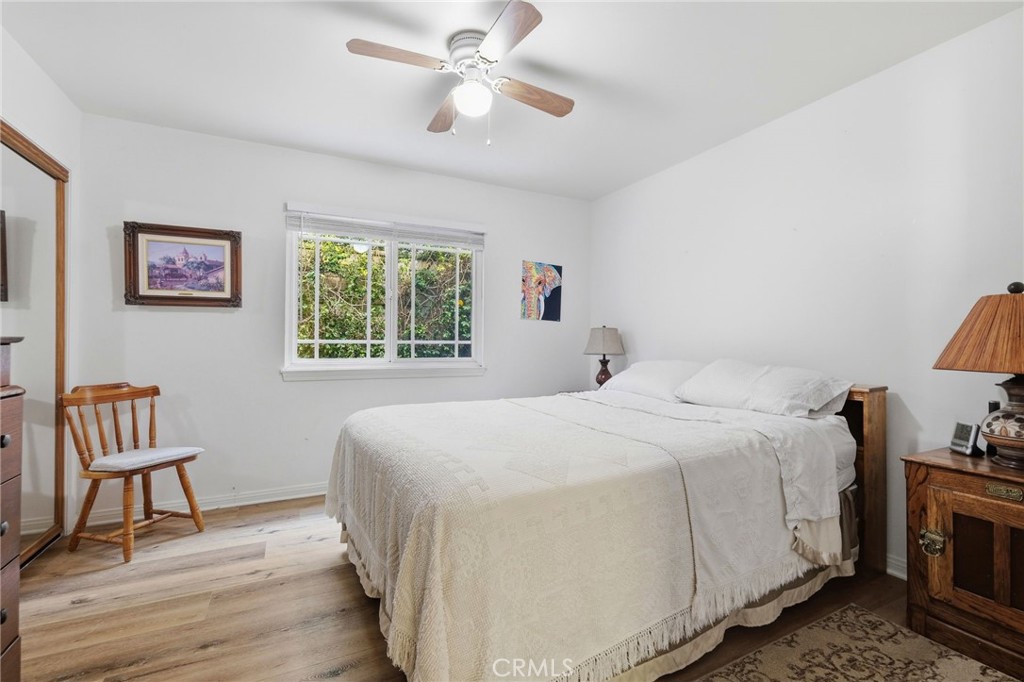 18233 Charlton Lane Porter Ranch, CA 91326 - Photo 10 of 40 a bedroom with a bed and a chandelier