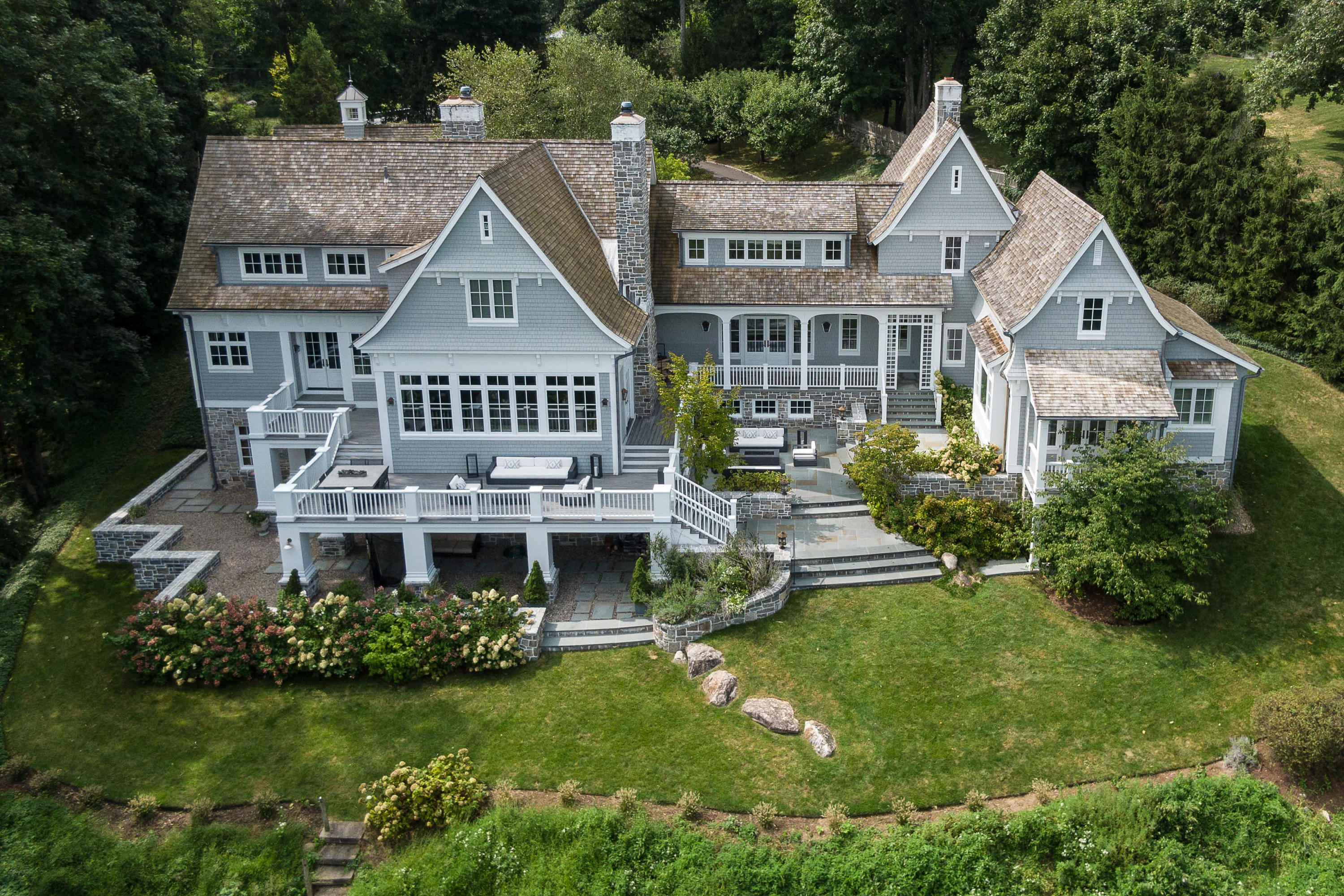 a aerial view of a house with a garden and deck