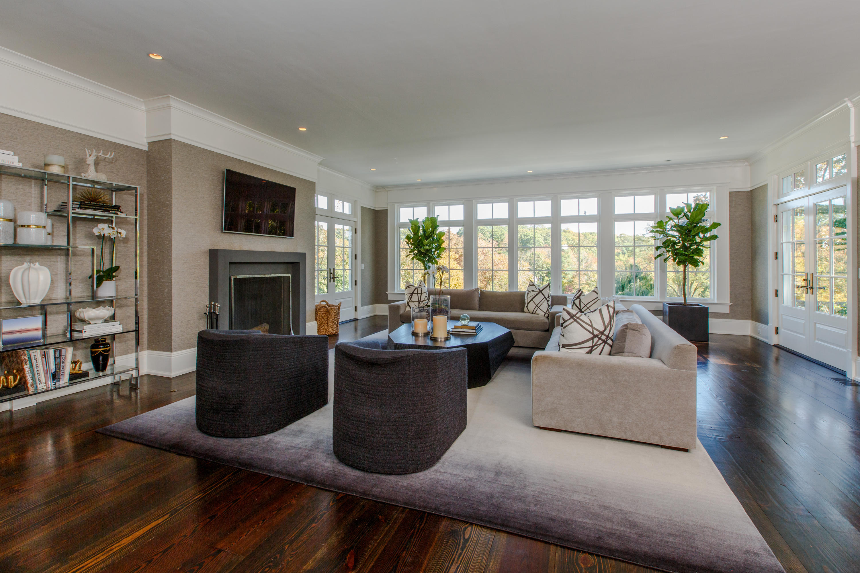 51 Lambert Road New Canaan, CT 06840 - Photo 11 of 62 a living room with furniture a fireplace and a large window