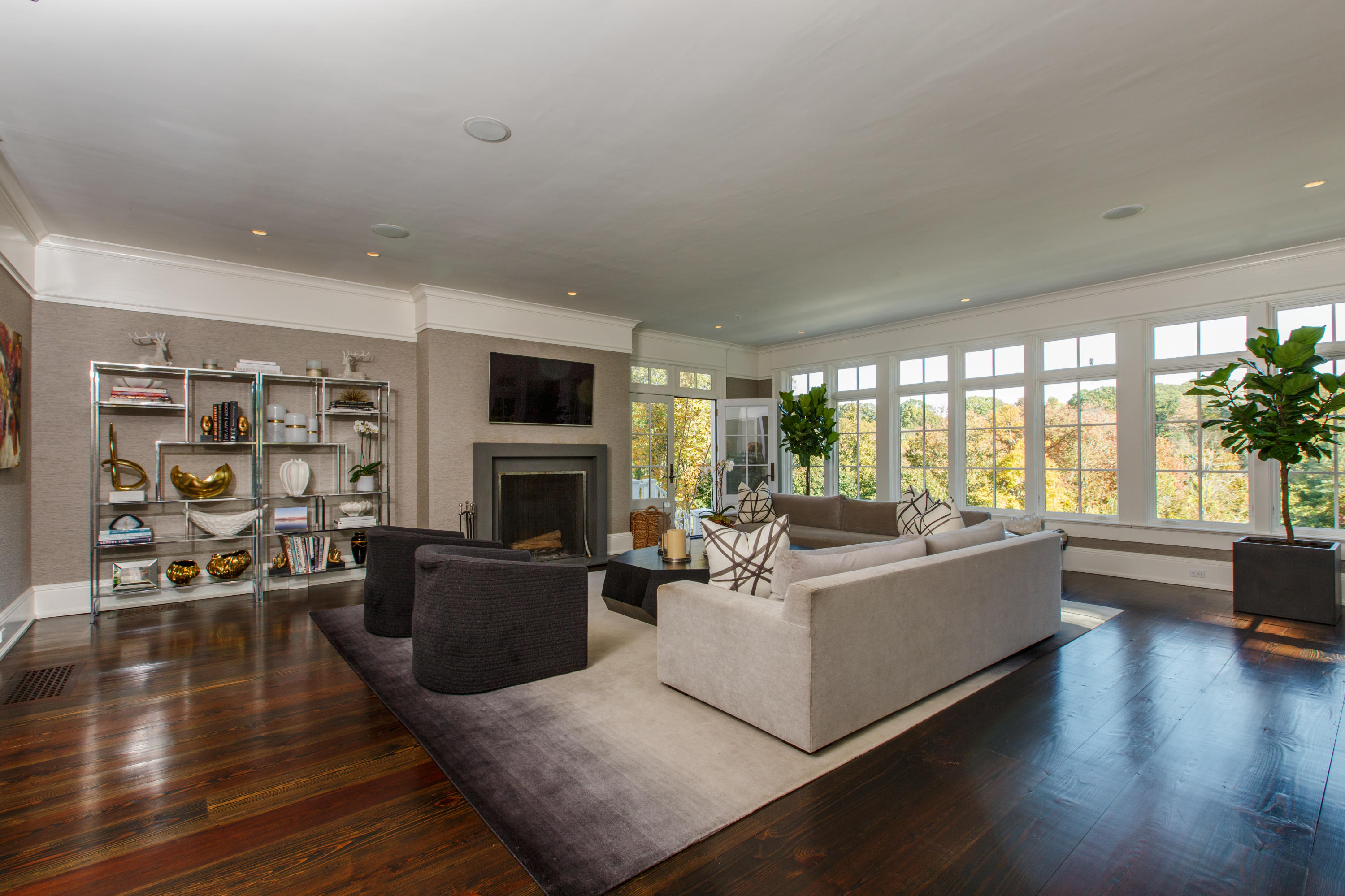 51 Lambert Road New Canaan, CT 06840 - Photo 12 of 62 a living room with furniture large window and wooden floor