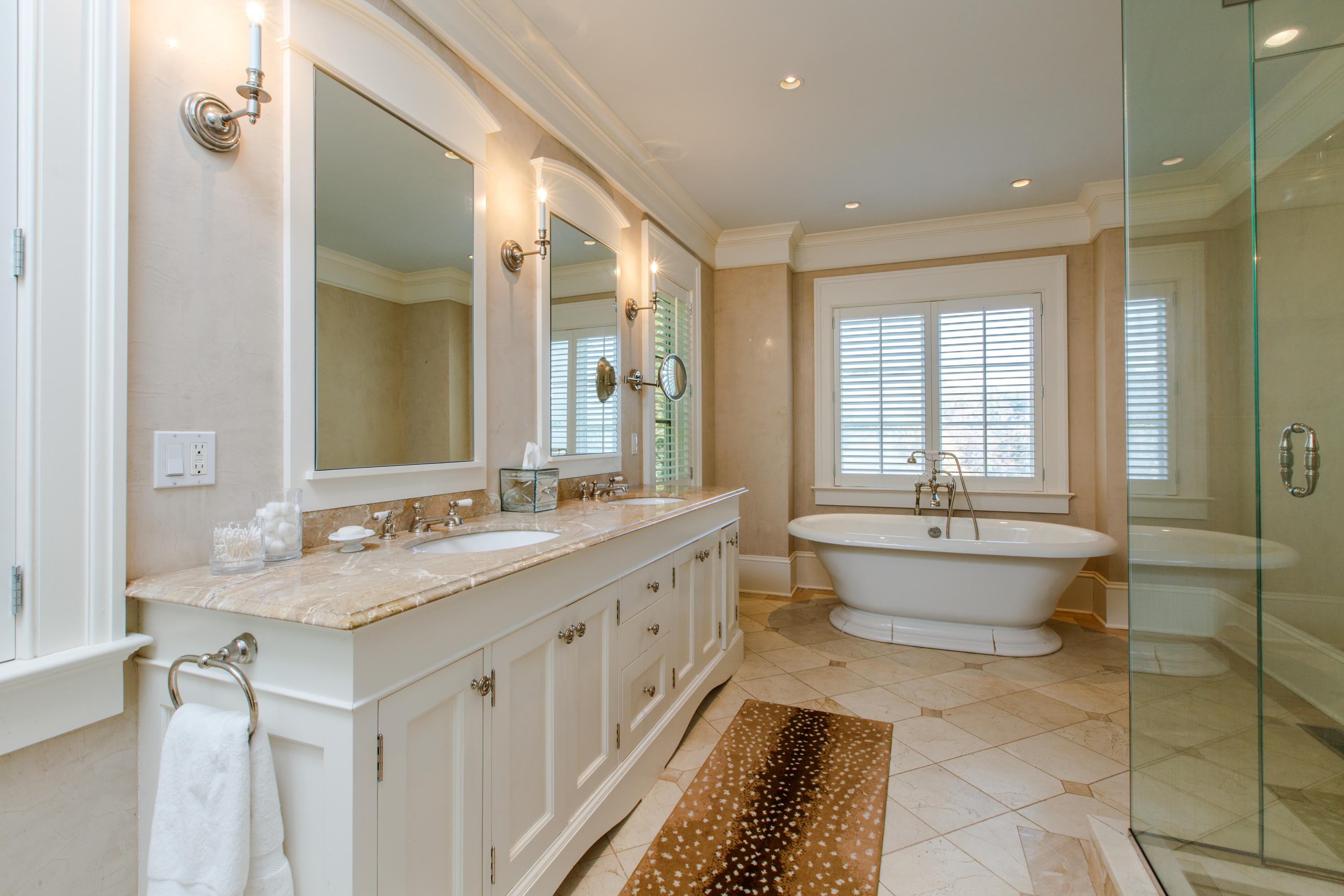 51 Lambert Road New Canaan, CT 06840 - Photo 28 of 62 a bathroom with a double vanity sink mirror and bathtub