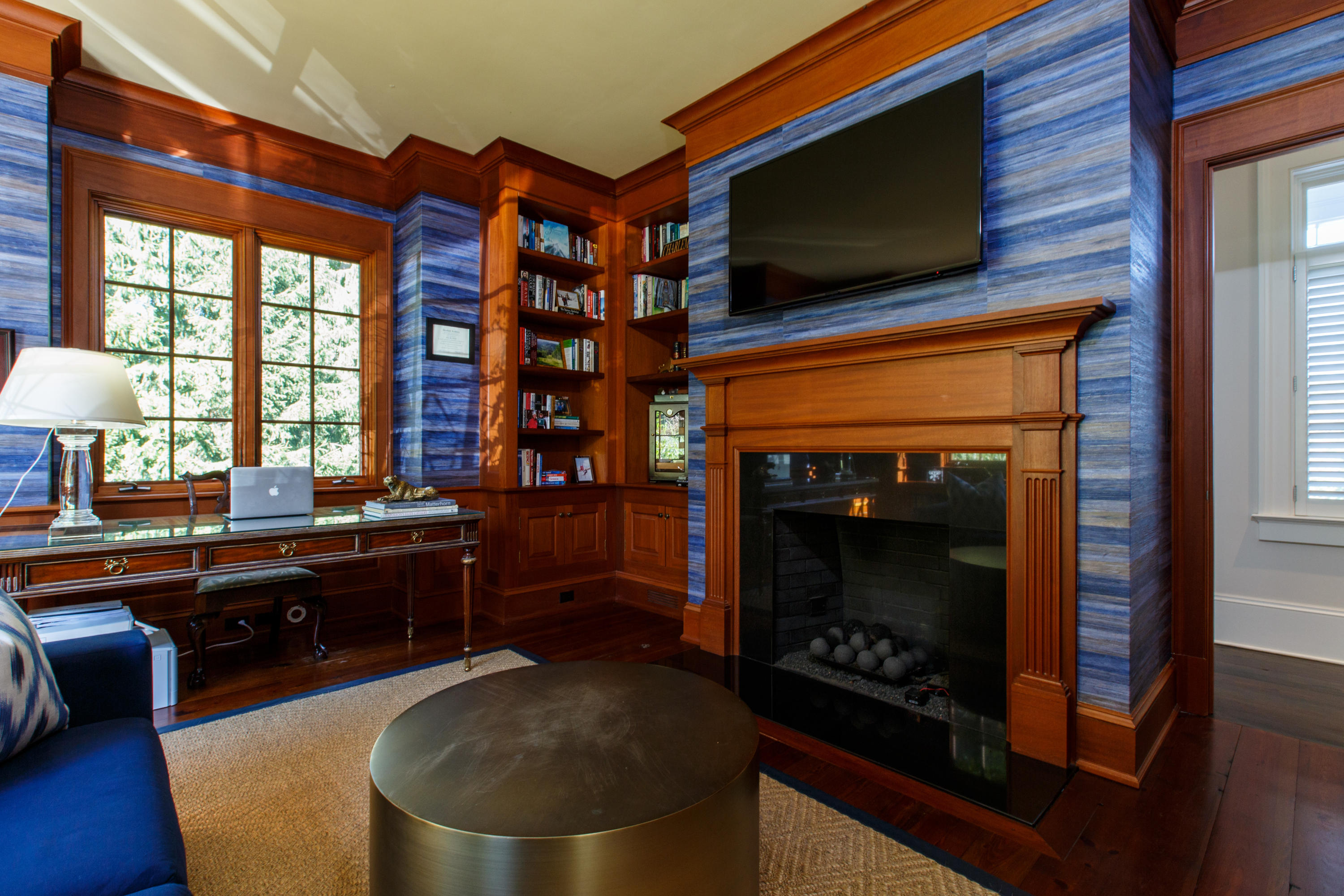 51 Lambert Road New Canaan, CT 06840 - Photo 31 of 62 a living room with furniture a flat screen tv and a fireplace