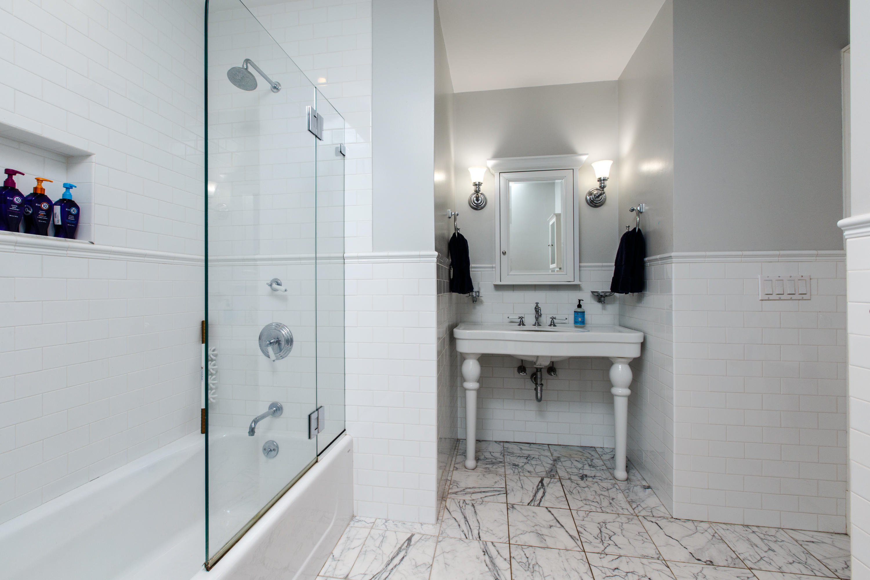 51 Lambert Road New Canaan, CT 06840 - Photo 36 of 62 a bathroom with a sink a toilet and shower