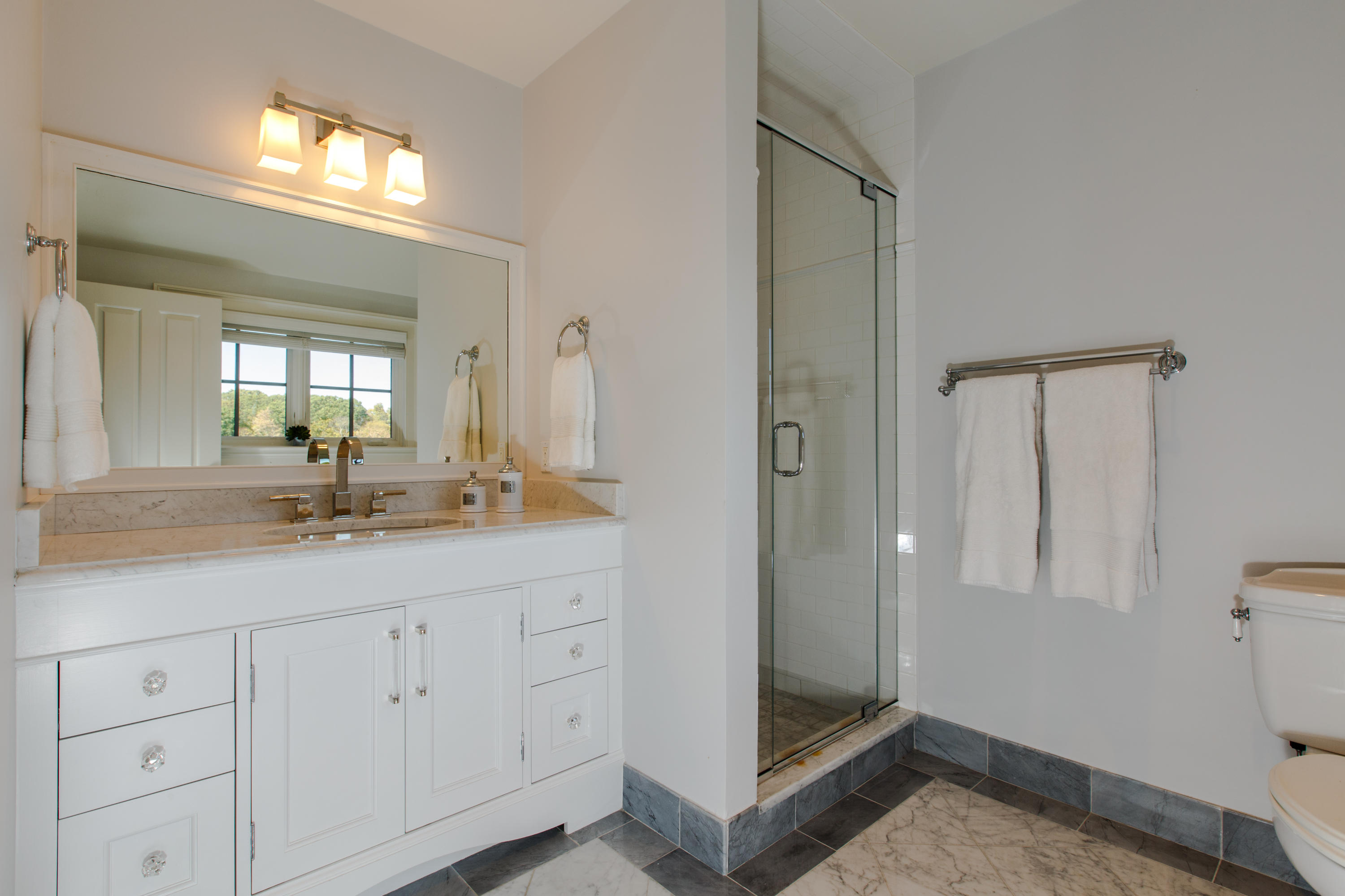 51 Lambert Road New Canaan, CT 06840 - Photo 38 of 62 a bathroom with a double vanity sink and a mirror