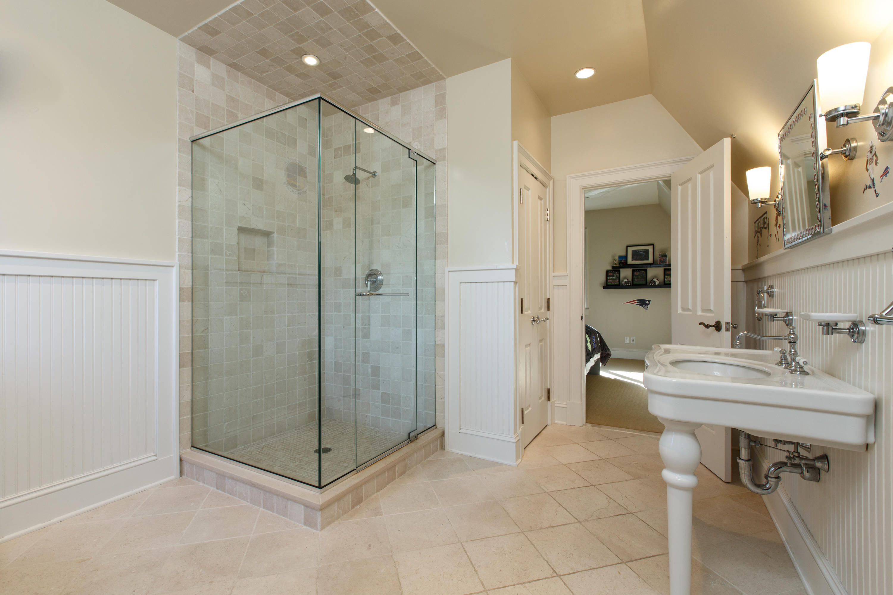 51 Lambert Road New Canaan, CT 06840 - Photo 45 of 62 a bathroom with a shower a sink and a mirror