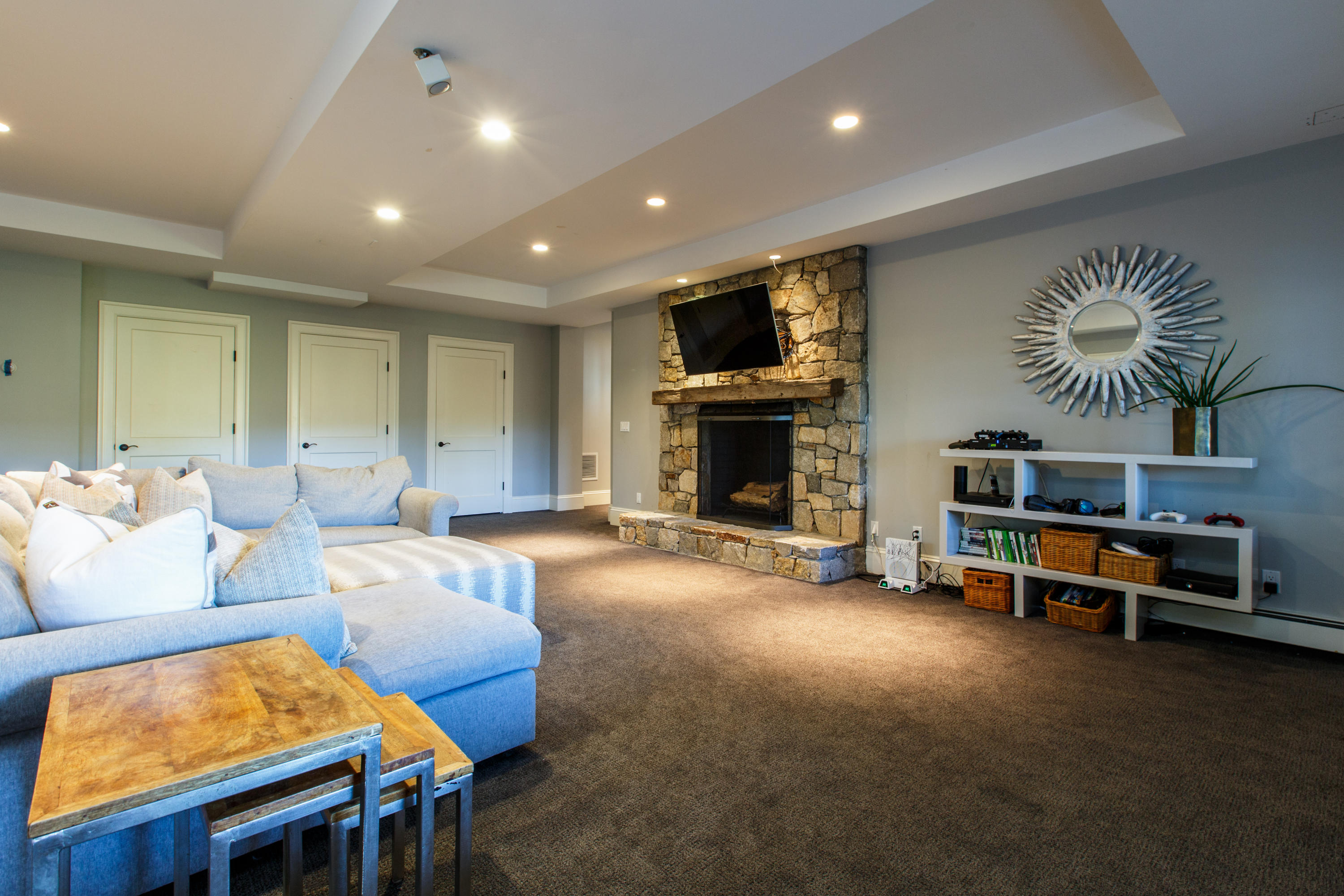 51 Lambert Road New Canaan, CT 06840 - Photo 47 of 62 a living room with furniture a fireplace and a flat screen tv