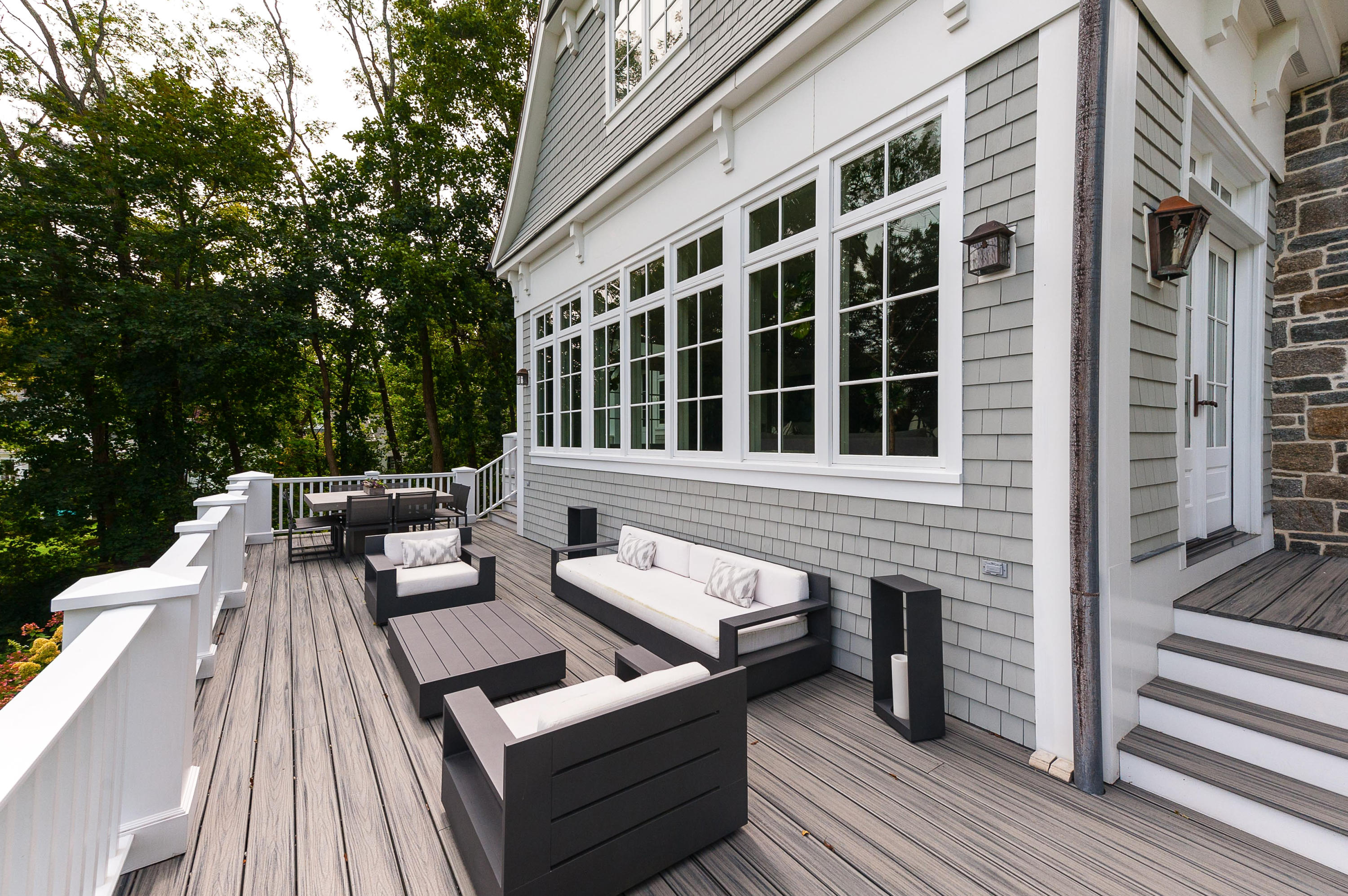 51 Lambert Road New Canaan, CT 06840 - Photo 52 of 62 a view of a deck with couches and wooden floor