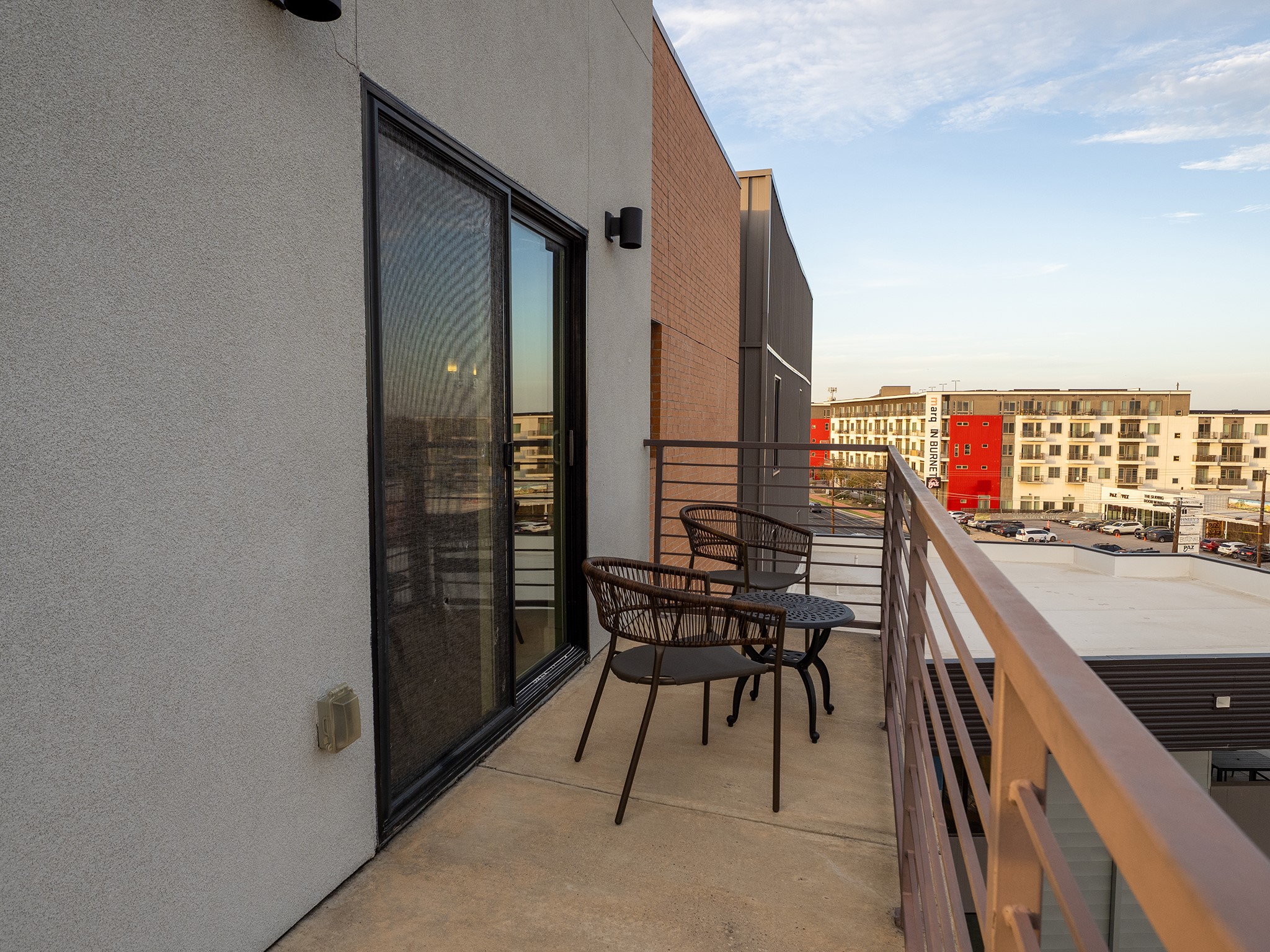 6444 Burnet Road, Unit 509 Austin, TX 78757 - Photo 20 of 32 Enjoy city vistas from this comfortable private balcony.