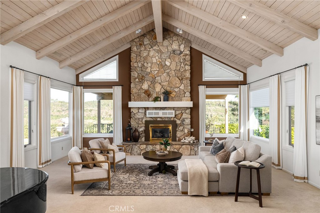 14868 Eagle Ridge Drive Forest Ranch, CA 95942 - Photo 11 of 69 a living room with furniture large windows and a fireplace