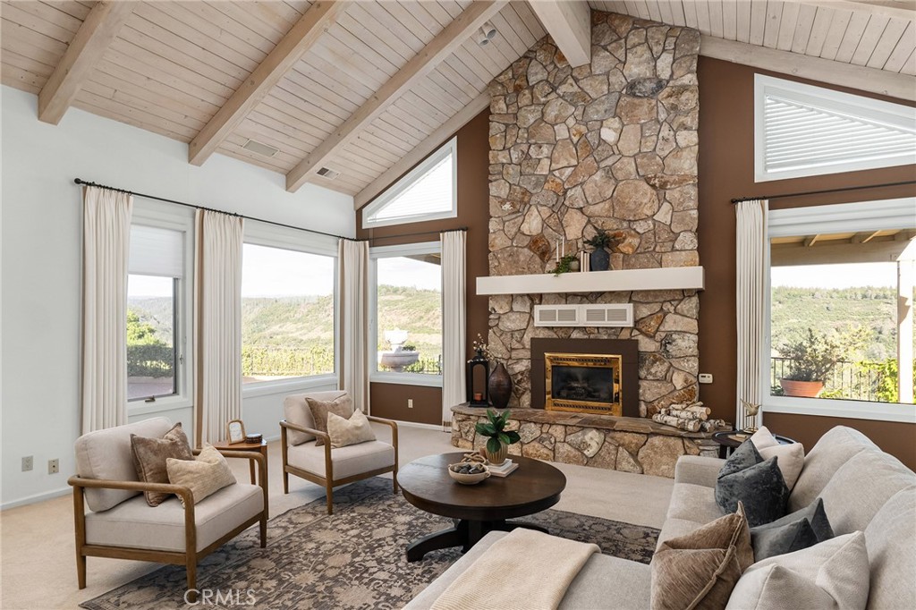 14868 Eagle Ridge Drive Forest Ranch, CA 95942 - Photo 12 of 69 a living room with furniture a fireplace and a large window