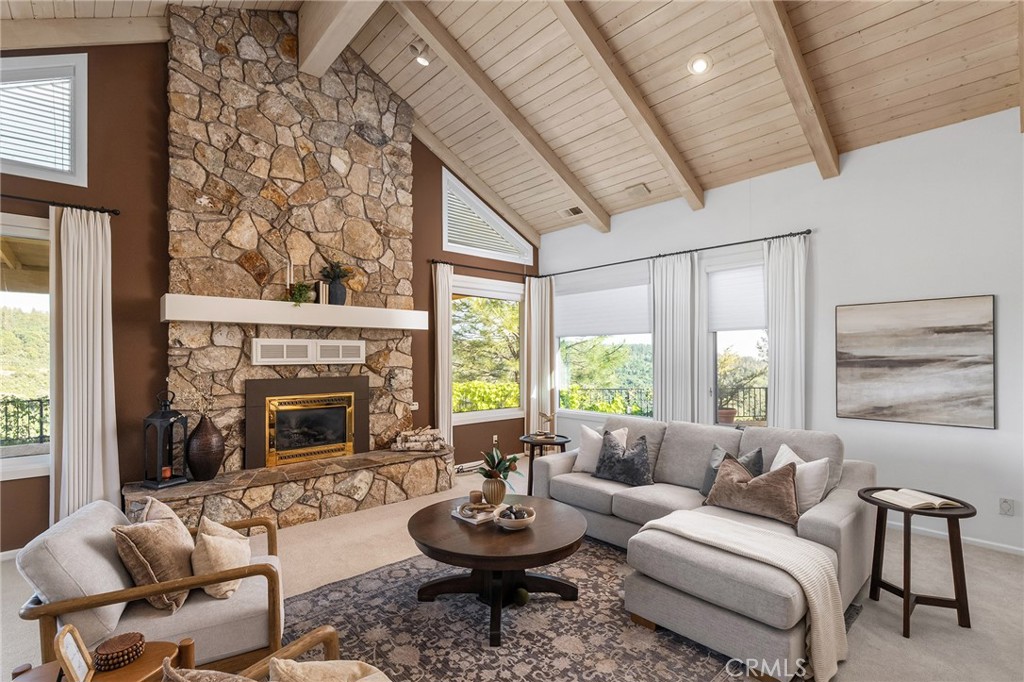 14868 Eagle Ridge Drive Forest Ranch, CA 95942 - Photo 13 of 69 a living room with furniture a fireplace and a large window
