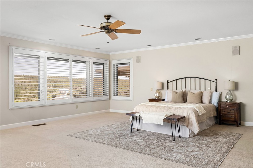 14868 Eagle Ridge Drive Forest Ranch, CA 95942 - Photo 29 of 69 a bedroom with a bed and a large window