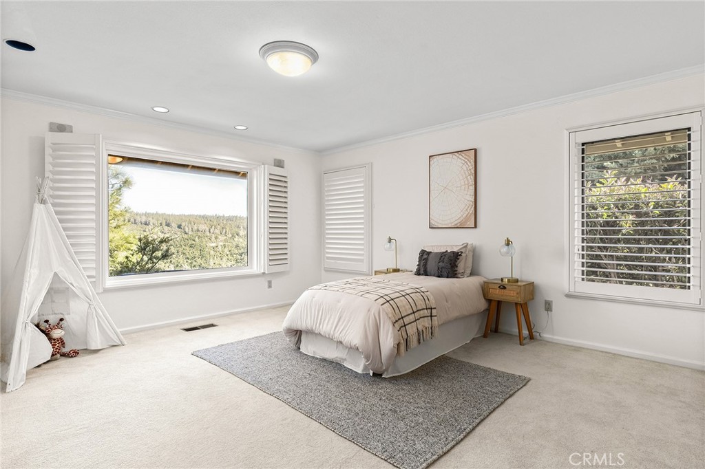14868 Eagle Ridge Drive Forest Ranch, CA 95942 - Photo 41 of 69 a bed room with a bed and a large window