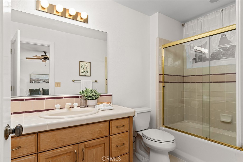 14868 Eagle Ridge Drive Forest Ranch, CA 95942 - Photo 47 of 69 a bathroom with a sink toilet and shower