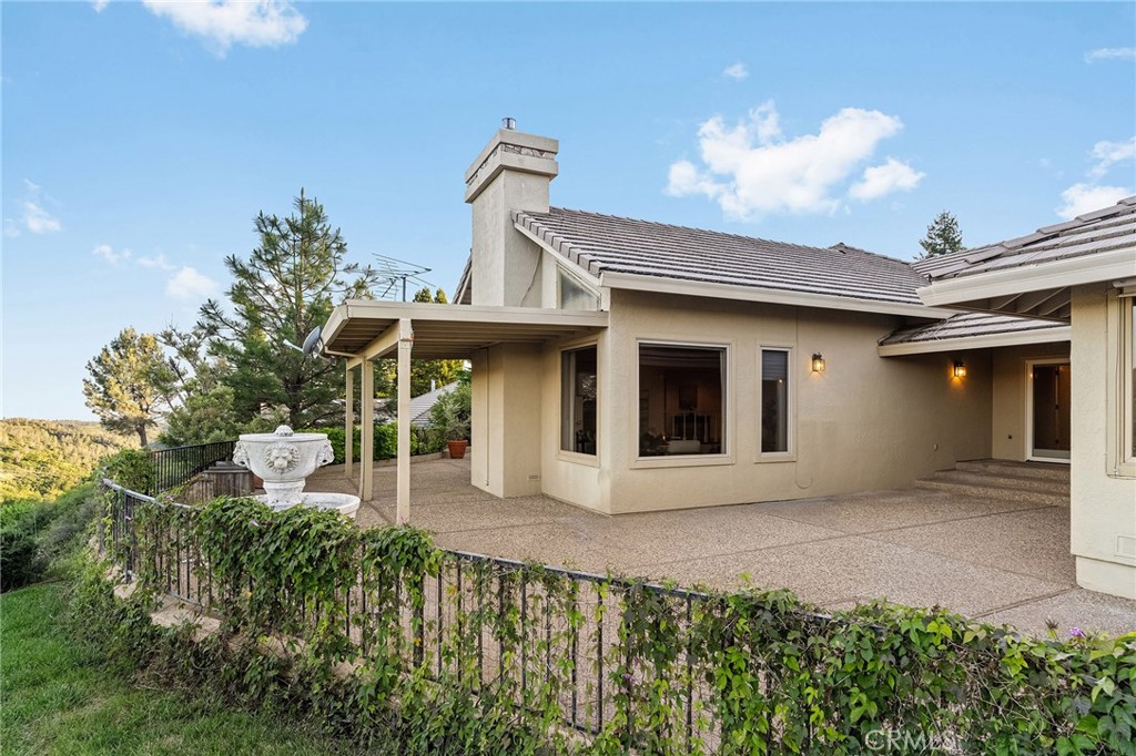 14868 Eagle Ridge Drive Forest Ranch, CA 95942 - Photo 49 of 69 a front view of a house with garden