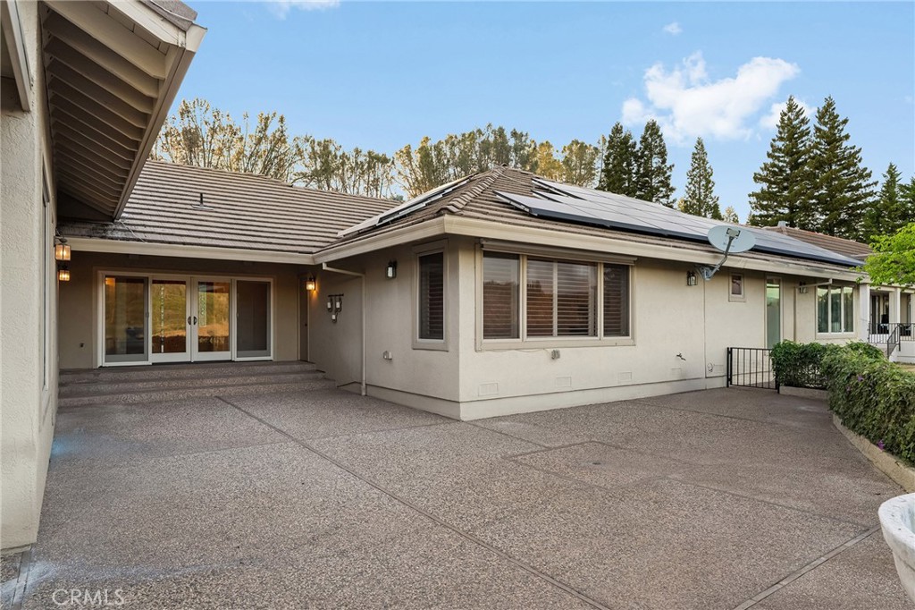 14868 Eagle Ridge Drive Forest Ranch, CA 95942 - Photo 52 of 69 a view of a house with a large window and potted plants