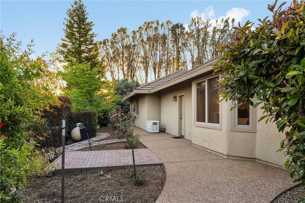 14868 Eagle Ridge Drive Forest Ranch, CA 95942 - Photo 53 of 69 a backyard of a house with table and chairs