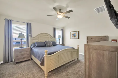 a bedroom with a bed and window