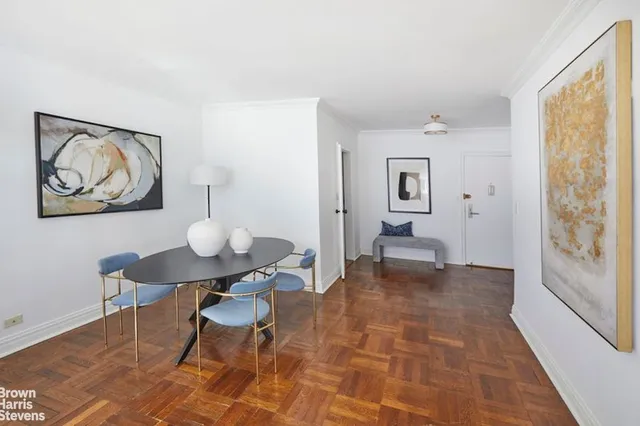 a view of a livingroom with furniture and a window