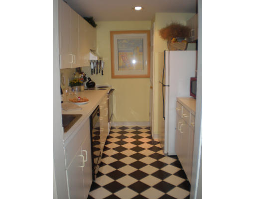 21 Linden Street, Unit 203 Quincy, MA 02170 - Photo 1 of 8 a kitchen with a sink and a stove