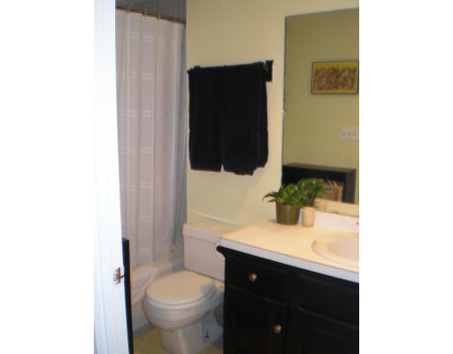 21 Linden Street, Unit 203 Quincy, MA 02170 - Photo 4 of 8 a bathroom with a sink and a toilet