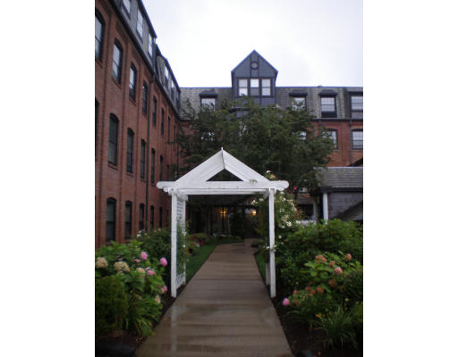 21 Linden Street, Unit 203 Quincy, MA 02170 - Photo 8 of 8 a front view of a house with garden
