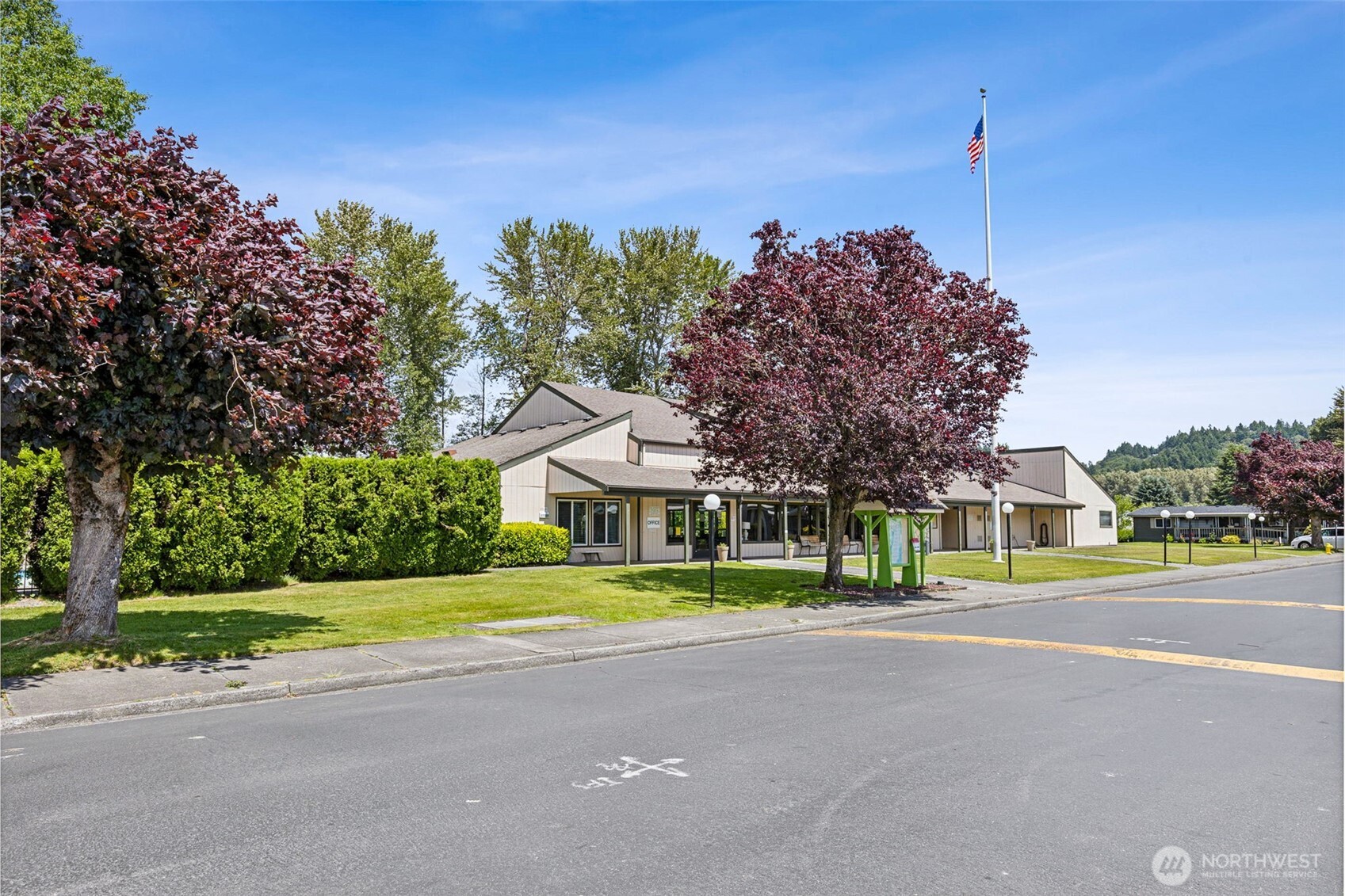 3611 I Street Northeast, Unit 72 Auburn, WA 98002 - Photo 21 of 25 a front view of a house with a big yard and palm trees