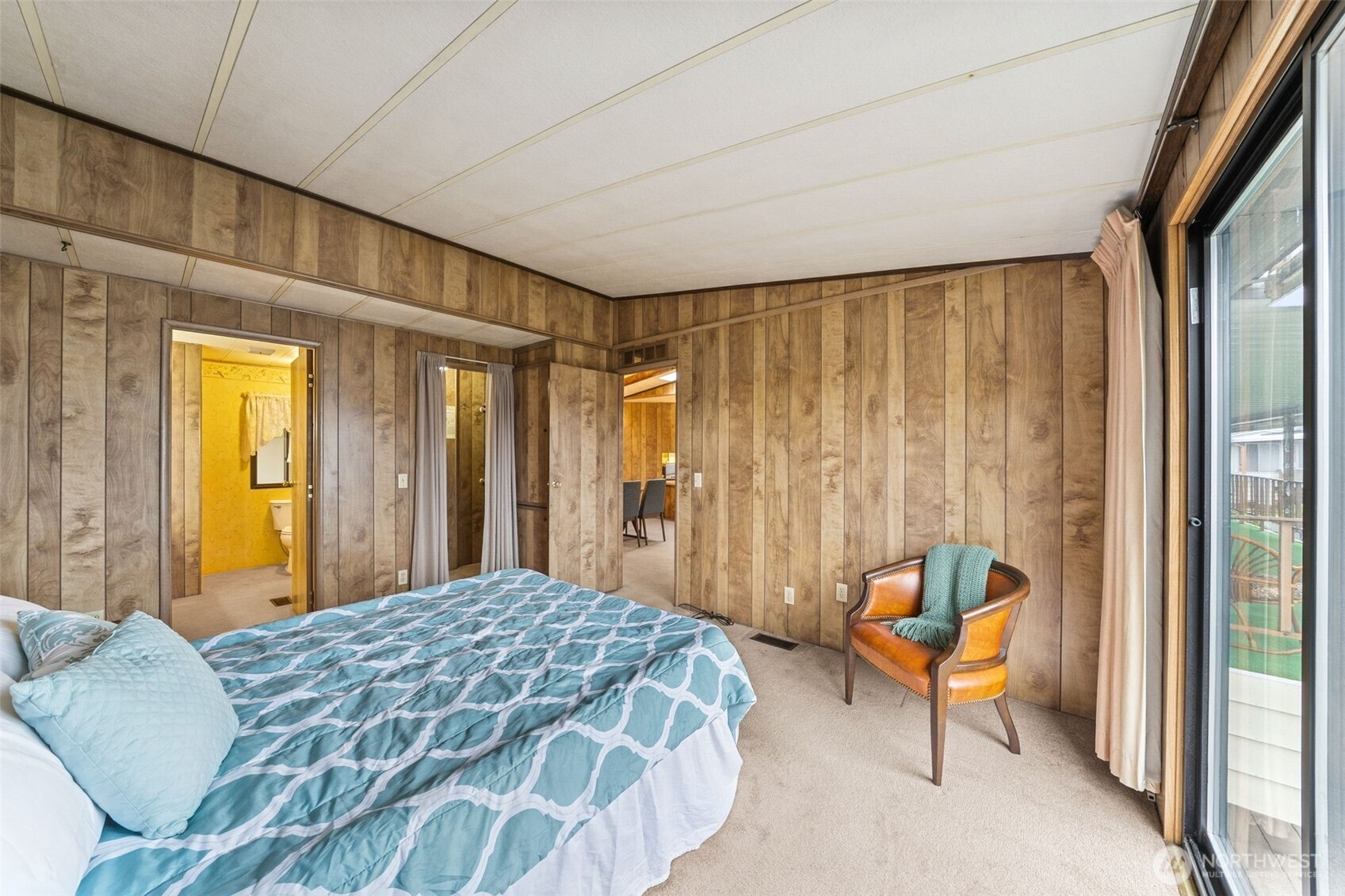 3611 I Street Northeast, Unit 72 Auburn, WA 98002 - Photo 9 of 25 a bedroom with a bed and a chandelier