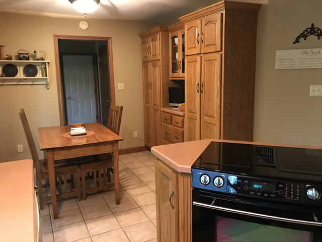 2115 East 875th Road Tonica, IL 61370 - Photo 12 of 41 a kitchen that has a stove and a table in it