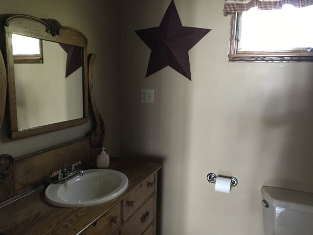 2115 East 875th Road Tonica, IL 61370 - Photo 20 of 41 a bathroom with a sink and mirror