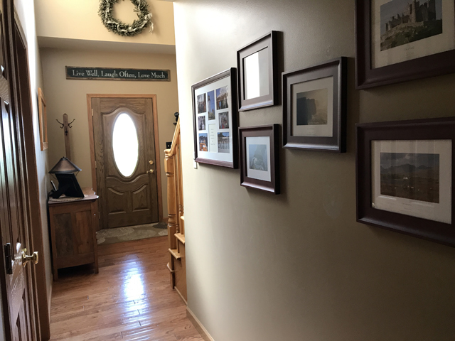 2115 East 875th Road Tonica, IL 61370 - Photo 3 of 41 a view of a livingroom with furniture a fireplace and wooden floor