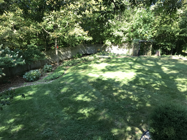 2115 East 875th Road Tonica, IL 61370 - Photo 33 of 41 a backyard of a house with lots of green space and fountain