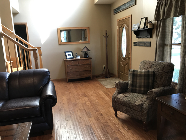 2115 East 875th Road Tonica, IL 61370 - Photo 4 of 41 a living room with furniture and a flat screen tv