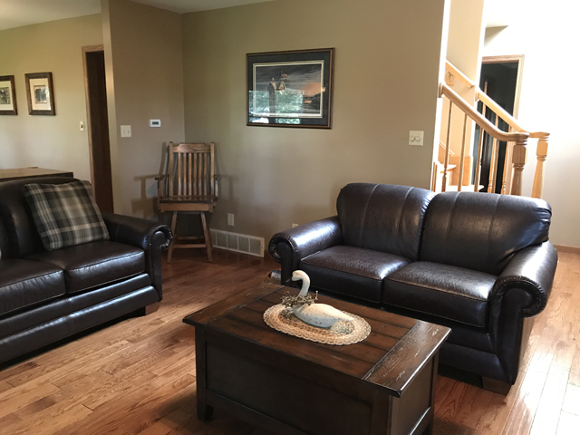 2115 East 875th Road Tonica, IL 61370 - Photo 7 of 41 a living room with furniture a couch and wooden floor