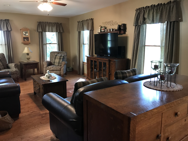 2115 East 875th Road Tonica, IL 61370 - Photo 8 of 41 a living room with furniture and a flat screen tv