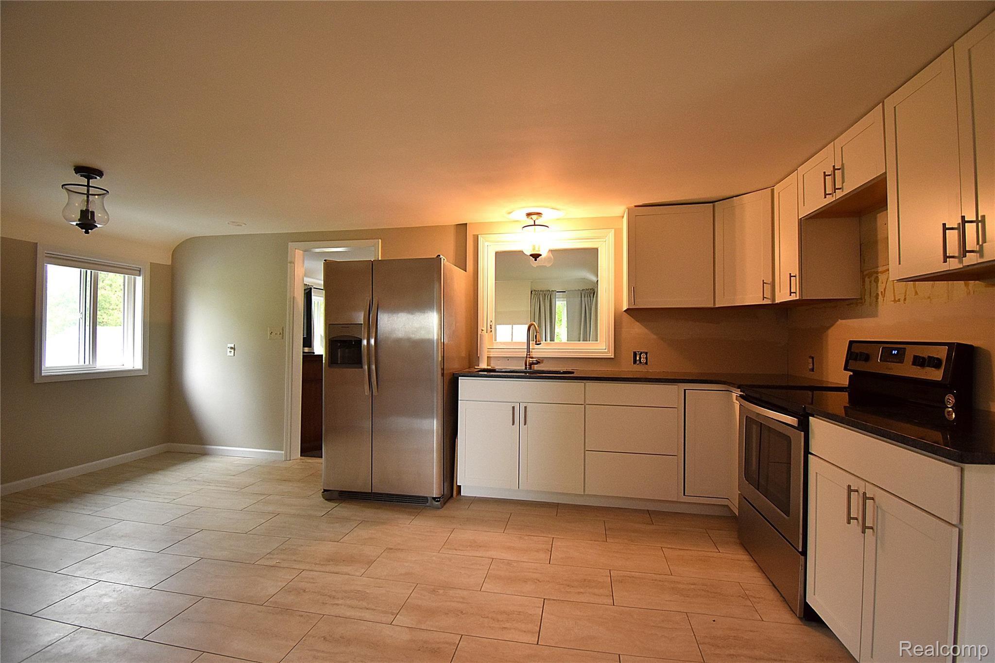 9670 Marshall Road South Lyon, MI 48178 - Photo 19 of 40 16 UPSTAIRS KITCHEN AND DINING .JPG