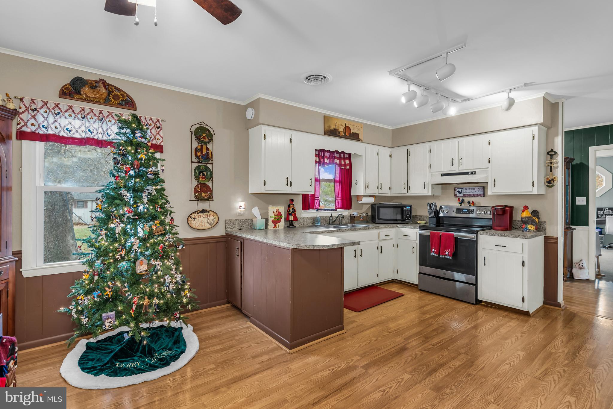 24383 Robins Creek Road Preston, MD 21655 - Photo 13 of 27 a kitchen with kitchen island granite countertop stainless steel appliances lots of counter top space