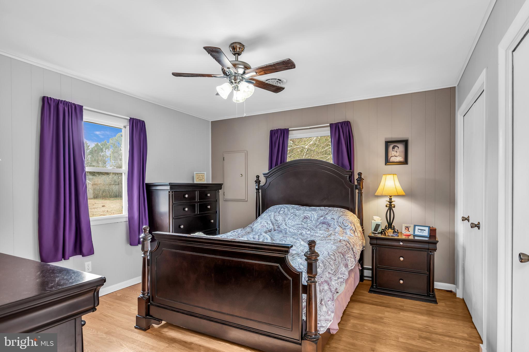 24383 Robins Creek Road Preston, MD 21655 - Photo 21 of 27 a bedroom with a bed and a tv