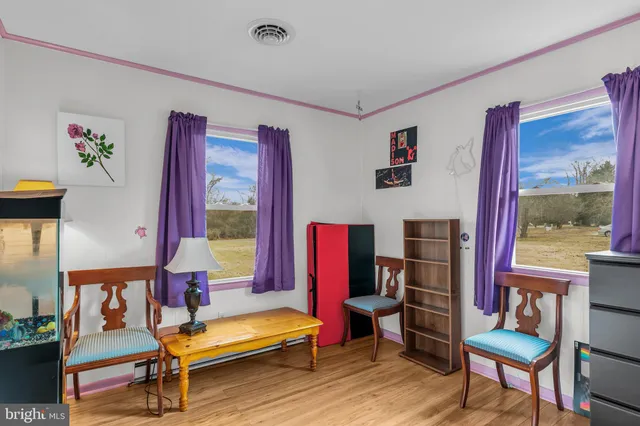 a bedroom with a bed and a tv