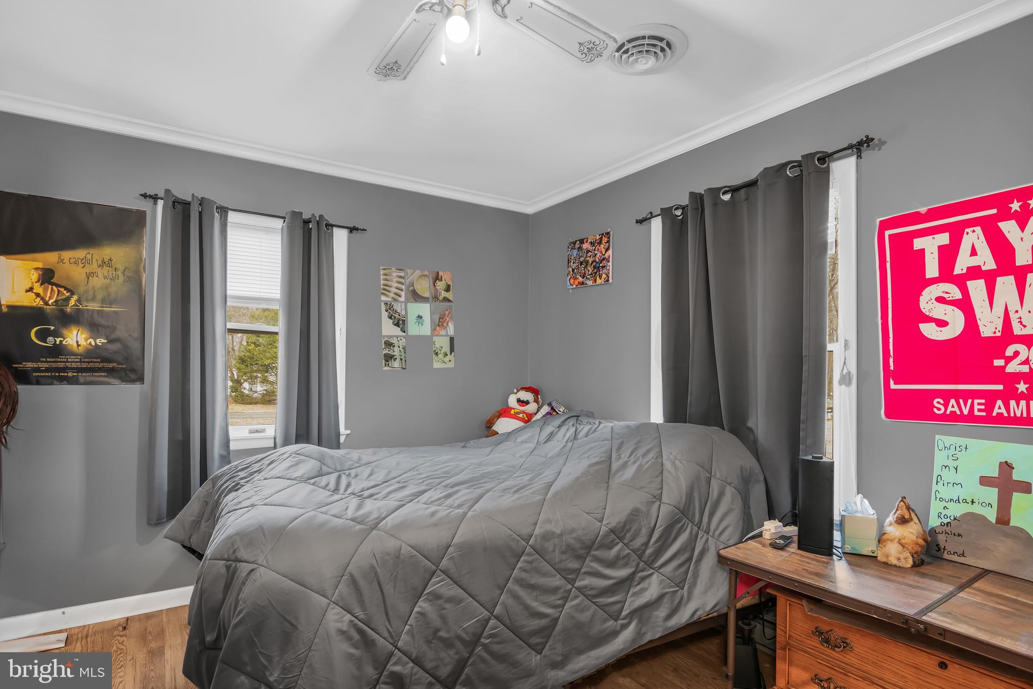 24383 Robins Creek Road Preston, MD 21655 - Photo 25 of 29 a bedroom with a bed and a dresser