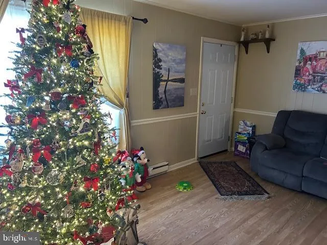 a living room with furniture and flowers