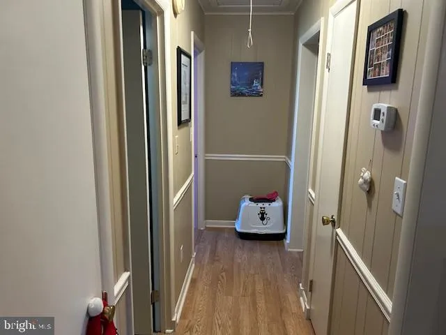 a view of bedroom with a bed and wooden floor