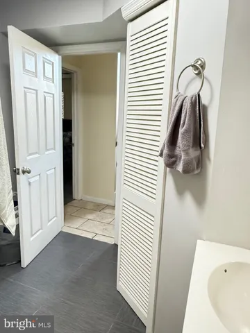 a view of a bedroom from a hallway